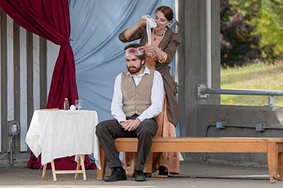 IMAGE #33 – production shot, student having bandage put on head